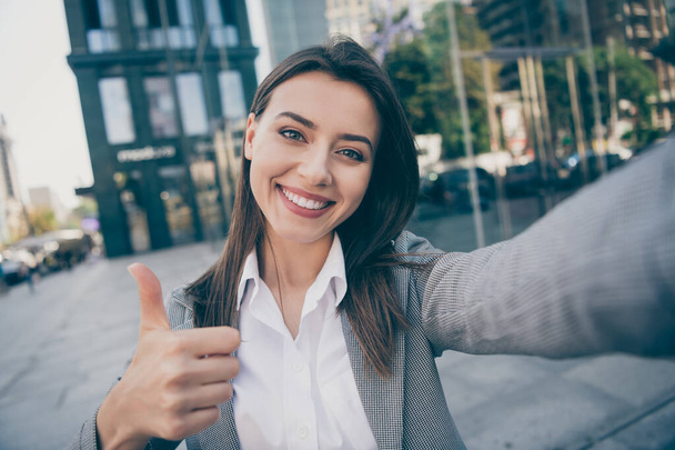 Photo of positive businessperson take selfie show thumb up wear formalwear blazer outside in outdoors - Фото, изображение
