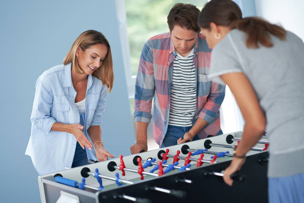 Group of students playing table soccer in the campus - Photo, Image