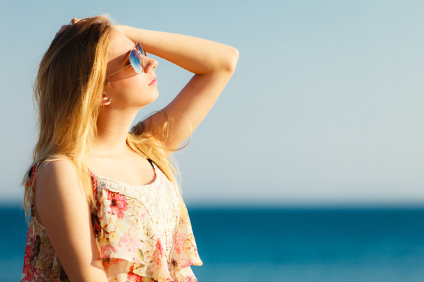 Summer vacation. Girl standing alone on the beach. - Zdjęcie, obraz