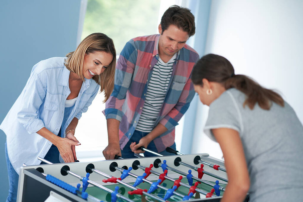 Group of students playing table soccer in the campus - Fotografie, Obrázek
