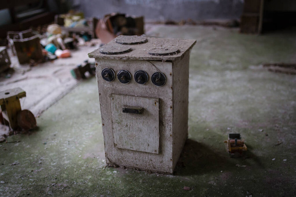 Children's toy kitchen stove in the kindergarten of the abandoned city of pripyat - Photo, Image