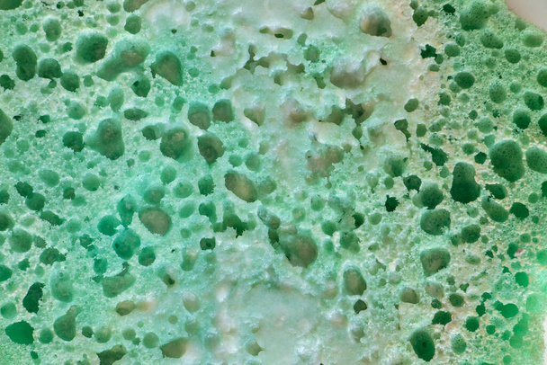 zelená houba pro koupání v pěně jako pozadí close-up - Fotografie, Obrázek