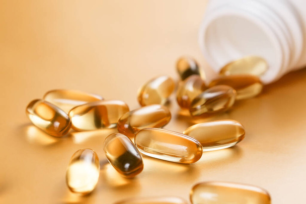 Many capsules Omega 3 on yellow background. Close up, high resolution product. Health care concept. - Fotografie, Obrázek
