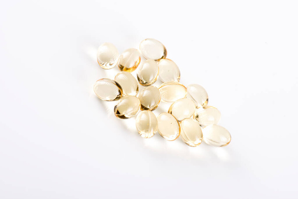Vitamin D capsules on white background - Foto, Imagem
