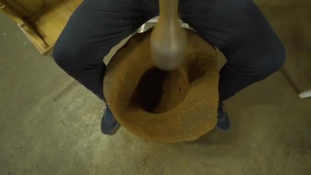 A man beating Turkish coffee with a mallet - Filmati, video