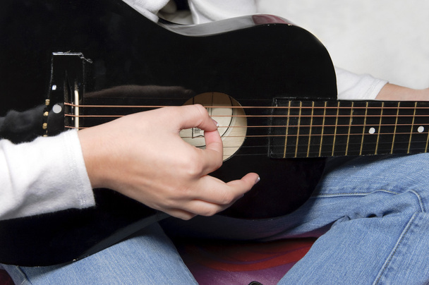 Playing a Black Guitar - Photo, Image