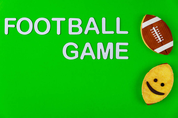 Text football game with cookies as a rugby ball. American sport game. - Photo, Image