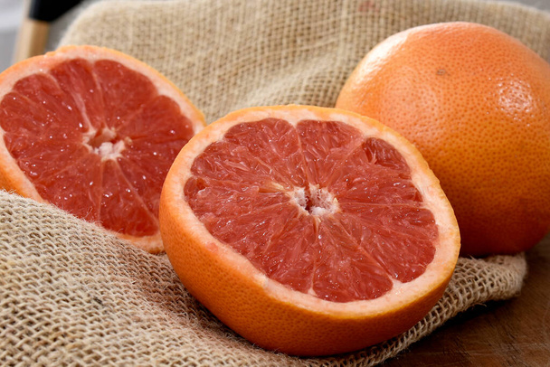 ripe grapefruits on a wooden table - Photo, Image