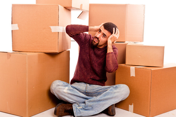 Stressed Young Man on Moving Swamped with Boxes - Fotó, kép