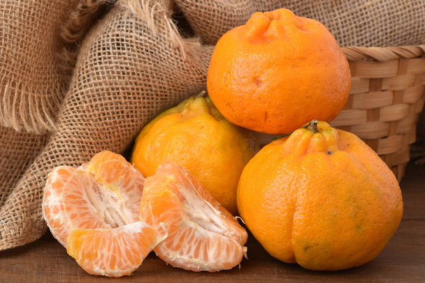 ripe tangerines on a wooden table - Photo, Image
