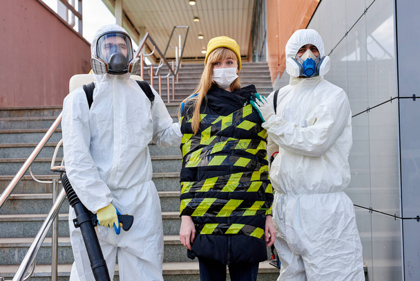 young infected woman with a coronavirus is taken out of the quarantine zone - Фото, зображення