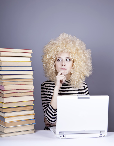 Funny girl in wig with notebook and books. - Photo, Image