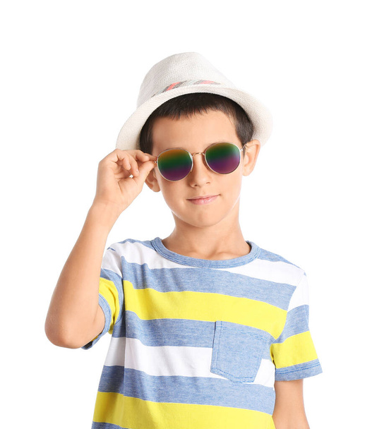 Cute boy wearing stylish sunglasses against white background - Foto, Imagem