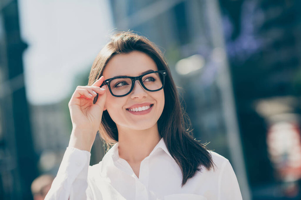 Photo of charming adorable young woman wear white formal shirt arm spectacles looking side outdoors - Φωτογραφία, εικόνα
