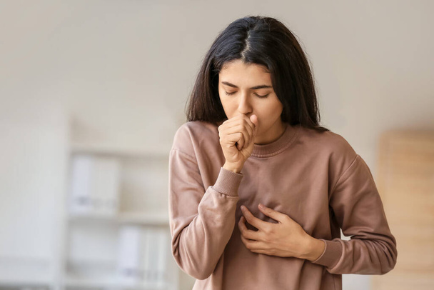 Coughing young woman at home - Foto, Imagem