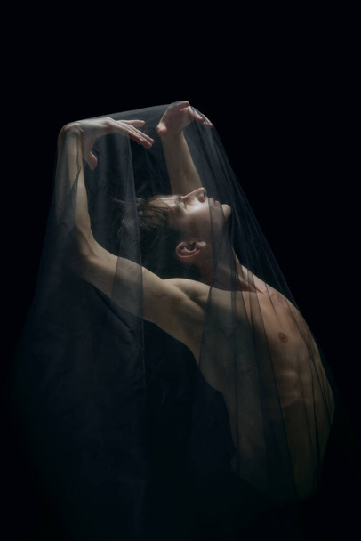 Graceful classic ballet dancer dancing isolated on dark studio background. The grace, artist, movement, action and motion concept. - Foto, Imagen