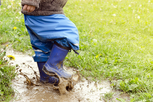 Child in puddle - Photo, Image