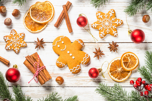 Christmas gingerbread cookies with spices and holidays decorations at white table. - Φωτογραφία, εικόνα