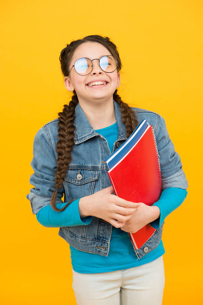 Education is a basic right. Happy child hold books yellow background. School education. Private teaching. Private lesson. September 1. Startup. Knowledge day. Educate yourself, motivate yourself - Φωτογραφία, εικόνα