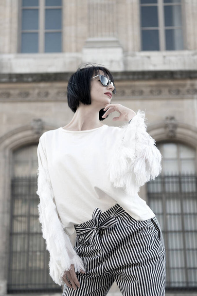 Woman in sunglasses pose in paris, france, fashion. Woman with brunette hair, red lips, makeup, beauty - Photo, Image