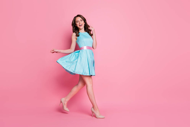 Full size profile side photo of energetic positive cheerful candid girl go walk copyspace wear good look clothes shoes isolated over pastel color background - Φωτογραφία, εικόνα