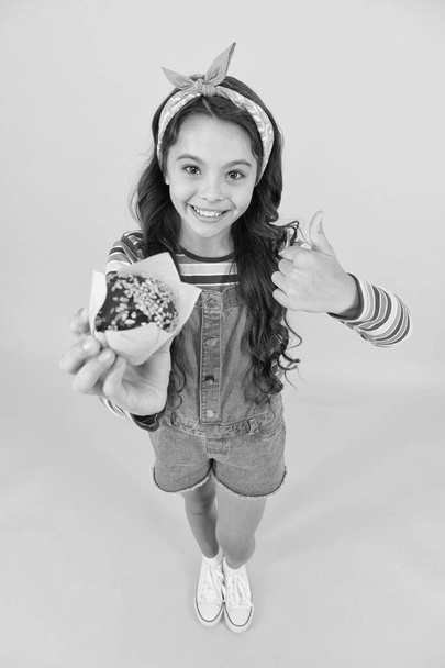 Sweet yummy muffin small girl, good choice concept - Photo, image