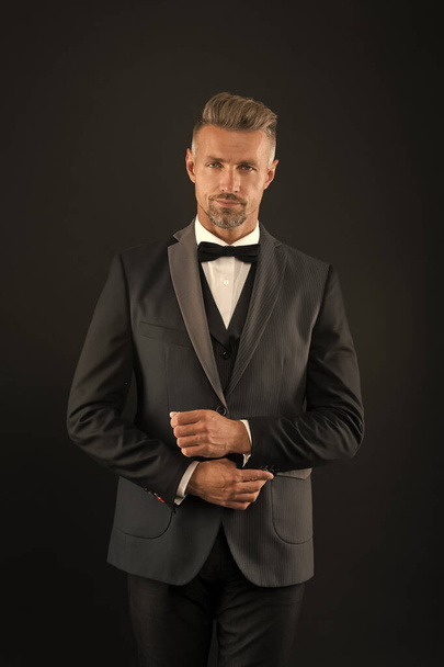 Classic glamour and elegance. Businessman dark background. Businessman wear classy suit. Handsome businessman in formalwear. Formal fashion and style. Professional businessman. Business dress code - Fotó, kép
