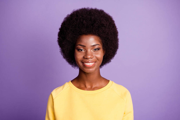 Photo of lovely young lady toothy smile look camera wear yellow sweater isolated purple color background - Φωτογραφία, εικόνα