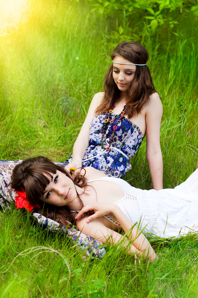 Young girls on the meadow - Фото, зображення