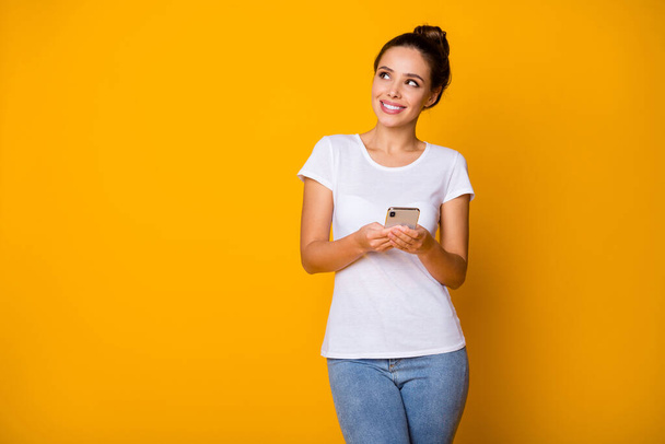 Portrait positive interested curious girl use smartphone look copyspace imagine perfect social network post wear white style stylish trendy clothes isolated over bright shine color background - Foto, immagini