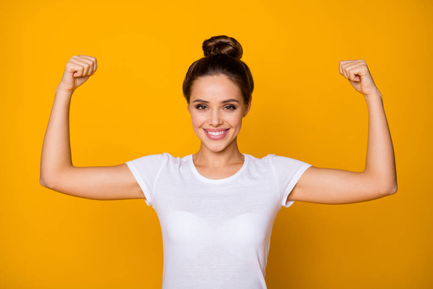 Portrait of cheerful strong super woman show her muscles she training sportive finess workout wear good look clothes isolated over vivid color background - Photo, Image