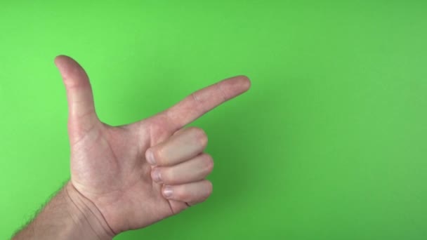 Footage of male hand pointing at copyspace over green background - Footage, Video