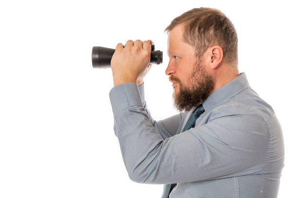 Soilid bearded man in shirt with binoculars - Foto, Bild