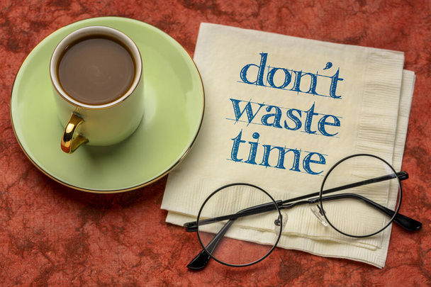do not waste time - inspirational handwriting on a napkin with a cup of coffee, business, procrastination and productivity concept - Zdjęcie, obraz