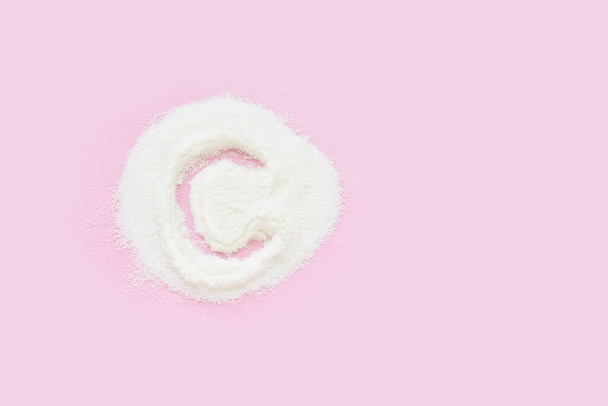 Collagen white powder. Pastel color background. Health product - Foto, Bild
