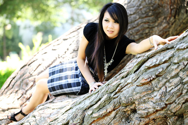 Young Asian American woman in oak tree dress - Photo, Image