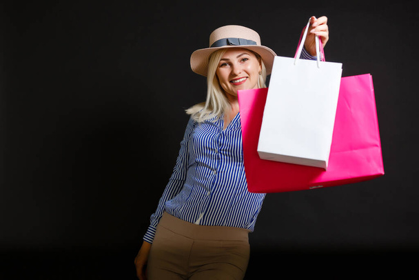 woman with shopping bags on black friday - Foto, Bild