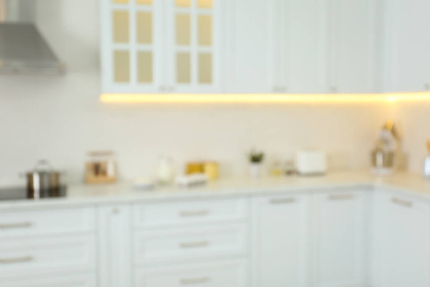 Blurred view of modern kitchen interior with stylish furniture - Фото, зображення