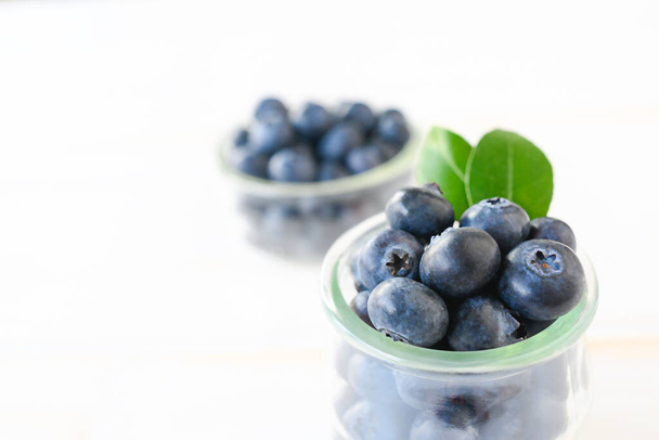 Blueberries Over White Background , wood. High quality photo - Φωτογραφία, εικόνα