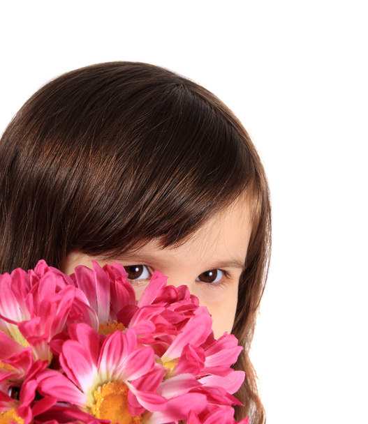 Pretty three year old girl with flowers - 写真・画像