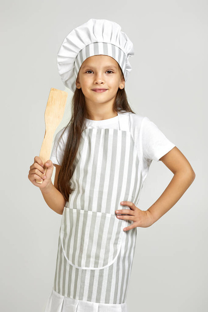 cute little girl in chef hat and apron - Foto, imagen