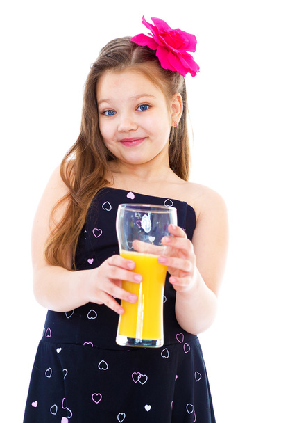 Young girl with glass of orange juice. - Zdjęcie, obraz
