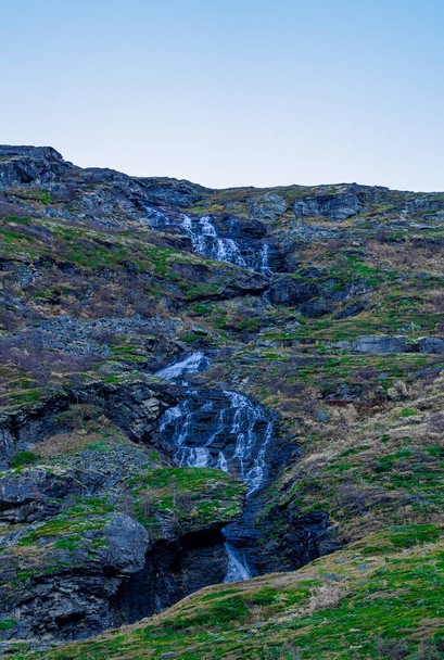 Waterfall free falling from a steep mountain slope. . High quality photo - 写真・画像