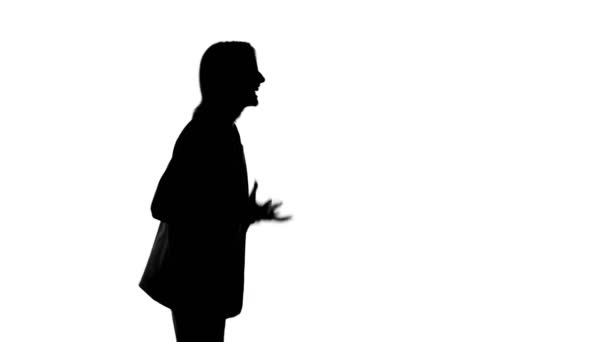 Video of screaming womans silhouette on isolated white background - Footage, Video