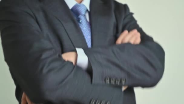 Man in a suit with folded arms. - Footage, Video