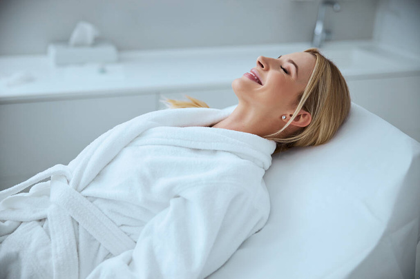 Cheerful client waiting for a spa procedure - Photo, Image