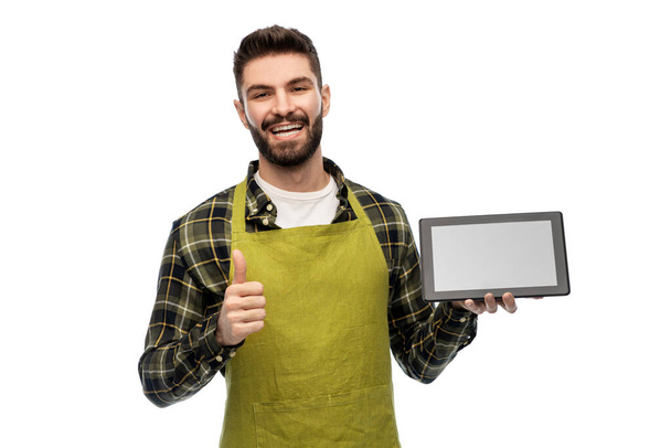 happy male farmer with tablet pc showing thumbs up - Photo, image