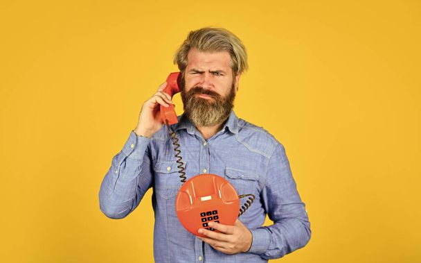 Outdated technology. Manager phone communication. Answering machine. Bearded hipster man phone conversation. Call clients. Retro phone. Marketing automation. Calling on Past Customers Script - Foto, immagini