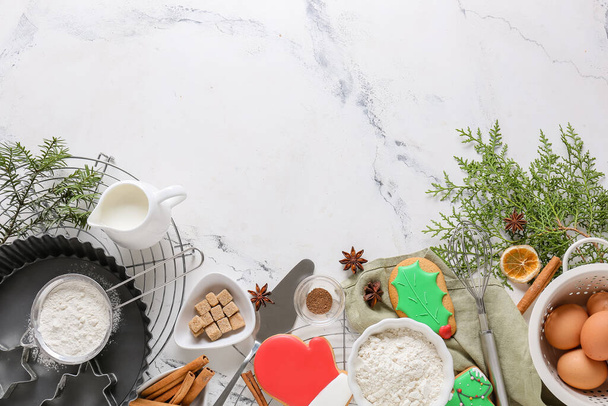 Ingredients for Christmas bakery and kitchen utensils on white background - Photo, image