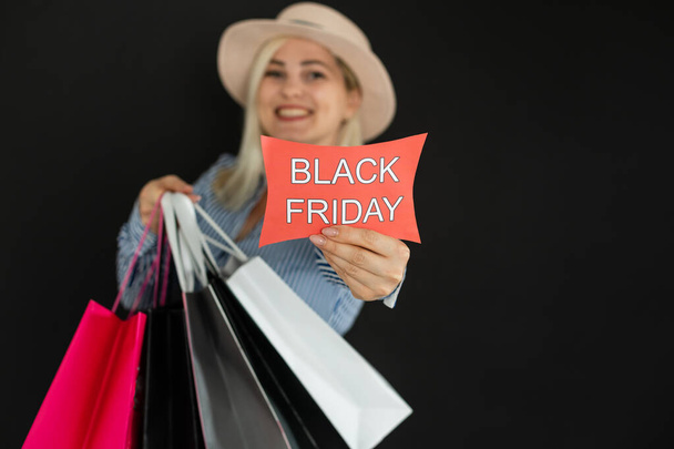 woman with shopping bags on black friday - Foto, Imagem